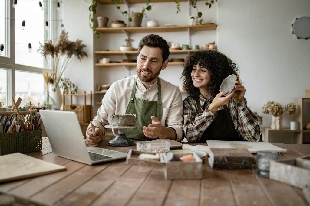 Couple creating pottery for online video tutorial or social media